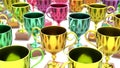 Variously Colored Trophys in a Tight Even Grid on a Simple Concrete Surface Royalty Free Stock Photo