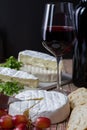 Varius cheese with red wine and grapes Royalty Free Stock Photo