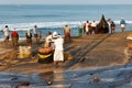 Fishing net with fishermen on backside. Odayam beach, Varkala, India