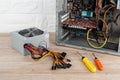 New power supply unit with colorful wires and connectors and two crosshead screwdrivers near tower computer case on a desk. Royalty Free Stock Photo