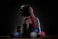 VARNA, BULGARIA - FEBRUARY 4, 2022: Krups Nescafe Dolce Gusto coffee maker machine and capsules on black background