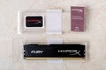 Opened box with one RAM Kingston Fury memory module, sticker and warranty. DIMM DDR 3 Kingston HyperX Fury top view