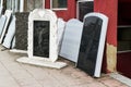 Small private firm produces tombstones and exhibites samples of its products on the street