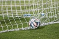 Varna, BULGARIA - MAY 30, 2015: Close-up official FIFA 2014 World Cup ball (Brazuca) in the goal (net). Adidas, a major German com Royalty Free Stock Photo