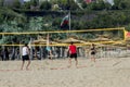 Varna Bulgaria 13 May 2017 people ride bicycles in the Park people play volleyball on the beach