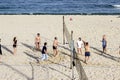 Varna Bulgaria 13 May 2017 people ride bicycles in the Park people play volleyball on the beach