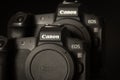 Varna, Bulgaria - September 8, 2021: Two Canon EOS R cameras on a black background. The new mirroless full frame Canon camera