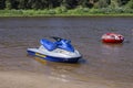 Varnavino, Nizhny Novgorod region, Russia - July 22, 2018: Water motorcycle, inflatable swimming circle on the Vetluga