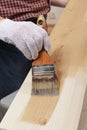 Varnishing a plank Royalty Free Stock Photo
