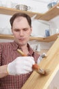 Varnishing wood shelves Royalty Free Stock Photo