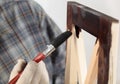 Varnishing a wooden part of furniture Royalty Free Stock Photo