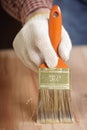 Varnishing the wooden plank Royalty Free Stock Photo