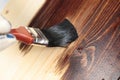 Varnishing a wooden shelf Royalty Free Stock Photo