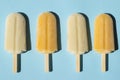 Varying popsicles on a turquoise background.