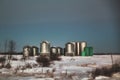 Steel grain storage bins on the prairies Royalty Free Stock Photo