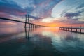 Vasco da Gama bridge over tagus river and pier in Lisbon at sunrise Royalty Free Stock Photo