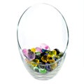 Vase with artificial decorative stones on white background