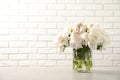 Vase with beautiful blooming peonies on table Royalty Free Stock Photo