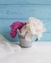 Vase of a beautiful peony holiday bouquet gentle soft on a colored anniversary wooden background fresh