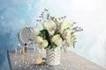 Vase with bouquet of beautiful flowers on table Royalty Free Stock Photo