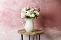 Vase with bouquet of beautiful flowers on table Royalty Free Stock Photo