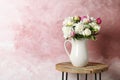 Vase with bouquet of beautiful flowers on table Royalty Free Stock Photo