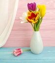 vase bouquet of tulips colorful on wooden background Royalty Free Stock Photo