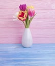 Vase bouquet of tulips decor home colorful romantic elegance on wooden background Royalty Free Stock Photo