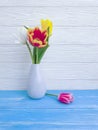 Vase bouquet of tulips decor home springtime colorful romantic elegance on wooden background