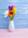 Vase bouquet of tulips colorful elegance on wooden background Royalty Free Stock Photo