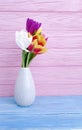Vase bouquet of tulips decor colorful romantic elegance on wooden background Royalty Free Stock Photo