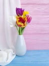 Vase bouquet of tulips colorful romantic elegance on wooden background Royalty Free Stock Photo