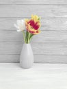 Vase bouquet of tulips decor springtime colorful romantic elegance on wooden background Royalty Free Stock Photo