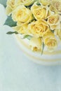 Vase with a bouquet of yellow spring roses