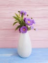 Vase of chrysanthemum beauty interior design autumn decorative flower, bell on wooden background