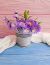 Vase of chrysanthemum flower, blooming season arrangement pot bell on wooden background