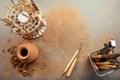 A vase of clay and tools on the table top view. potter makes a vase of clay in a pottery workshop . a woman holding a