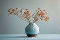 vase with dry dried flowers on table against light background Royalty Free Stock Photo