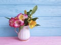 Vase flower alstroemeria seasonal on a wooden arrangement Royalty Free Stock Photo