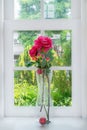 Vase with a flower on the windowsill country house