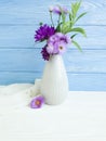 Vase flowers bell, purple elegance chrysanthemum arrangement on a wooden background Royalty Free Stock Photo