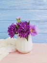 Vase flowers bell, purple elegance beauty interior decorative spring chrysanthemum arrangement on a wooden background Royalty Free Stock Photo