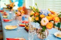 Vase with flowers on festive table. decoration of celebratory Banquet Royalty Free Stock Photo