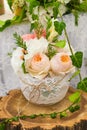 Vase of flowers on a wooden stump. Decoration for the table