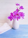 Vase orchid bouquet flower decor on wooden background