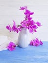 Vase orchid bouquet flower vintage decor on wooden background