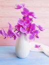 Vase orchid bouquet flower on wooden background