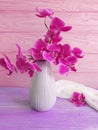 Vase orchid bouquet flower on wooden background