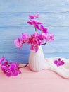 Vase orchid flower vintage decor elegance on wooden background