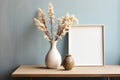 Empty Wooden Picture Frame. Framework. Vase with pampas grass.